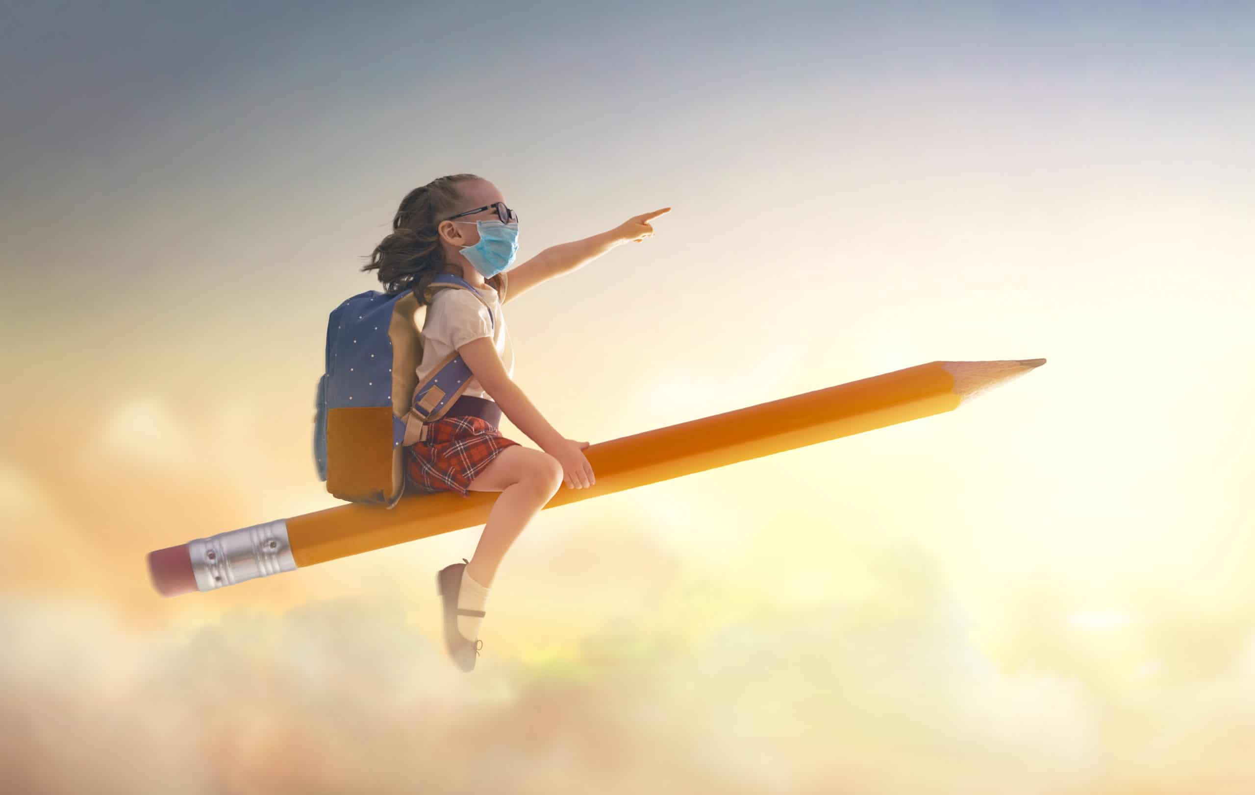 child flying on a pencil